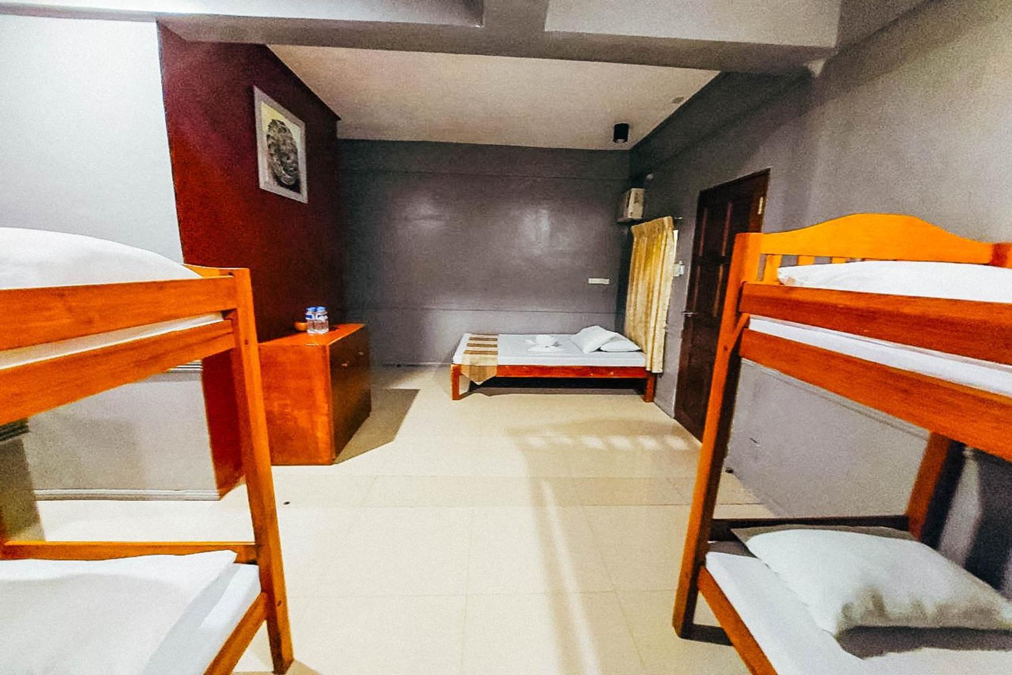 Mbg Travellers Inn Powered By Cocotel Пуэрто-Принцеса Номер фото