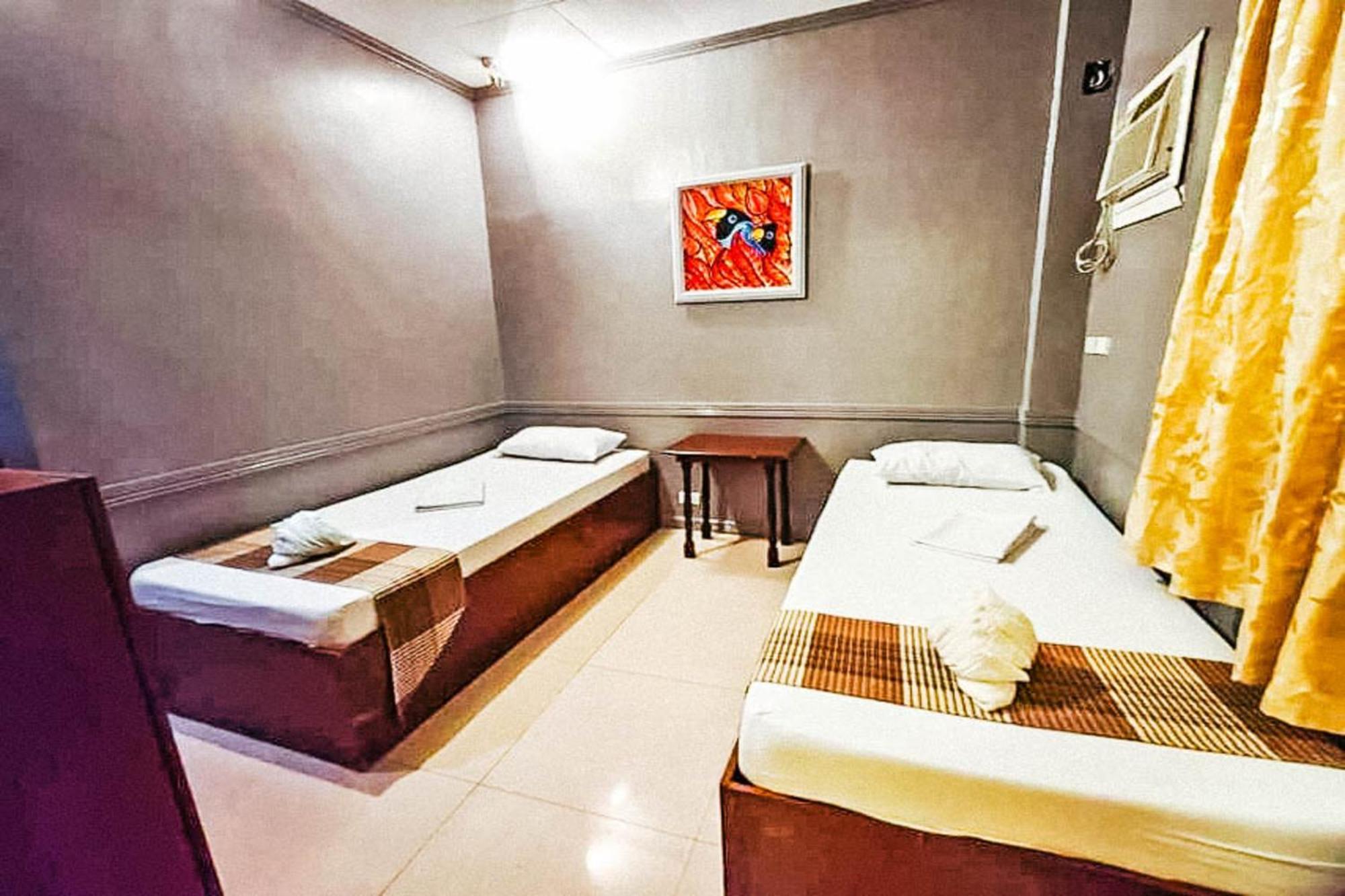 Mbg Travellers Inn Powered By Cocotel Пуэрто-Принцеса Номер фото
