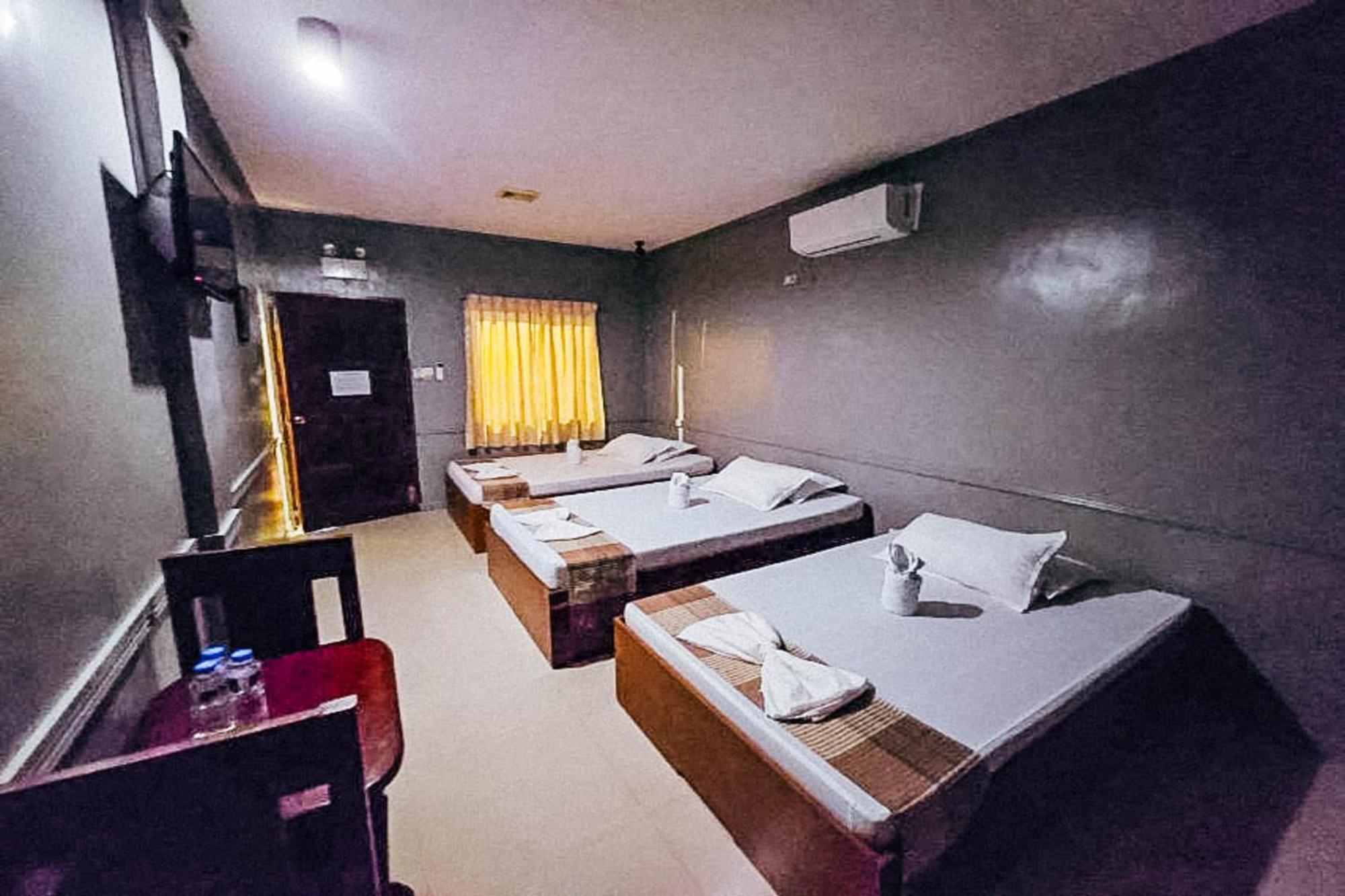 Mbg Travellers Inn Powered By Cocotel Пуэрто-Принцеса Номер фото
