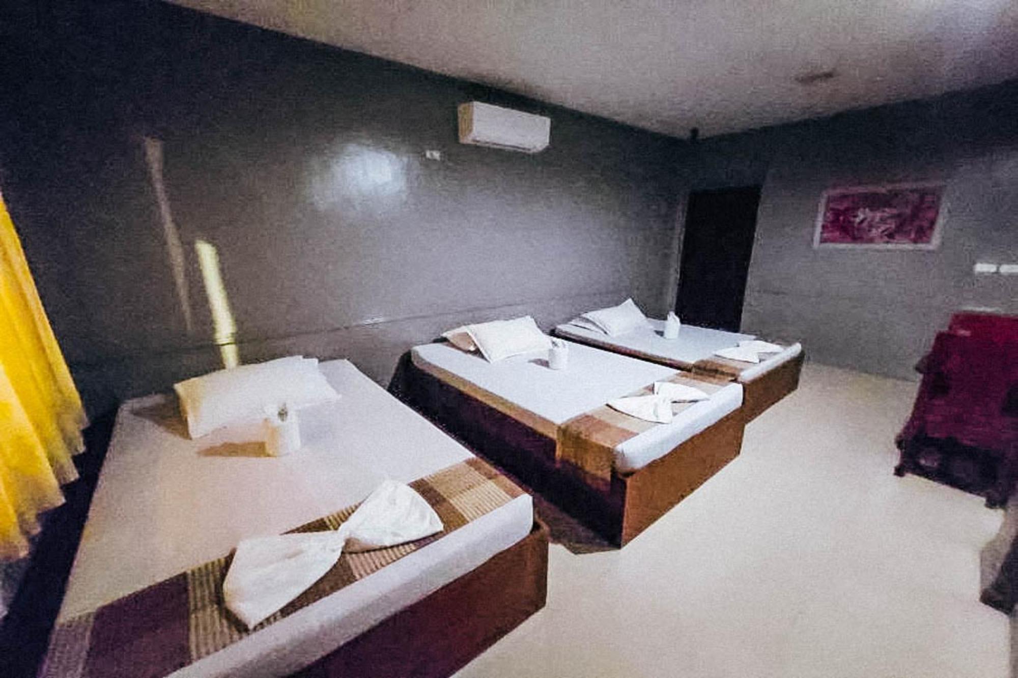 Mbg Travellers Inn Powered By Cocotel Пуэрто-Принцеса Номер фото