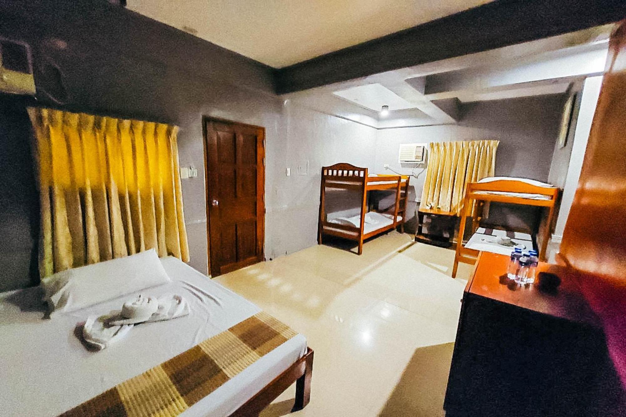 Mbg Travellers Inn Powered By Cocotel Пуэрто-Принцеса Номер фото