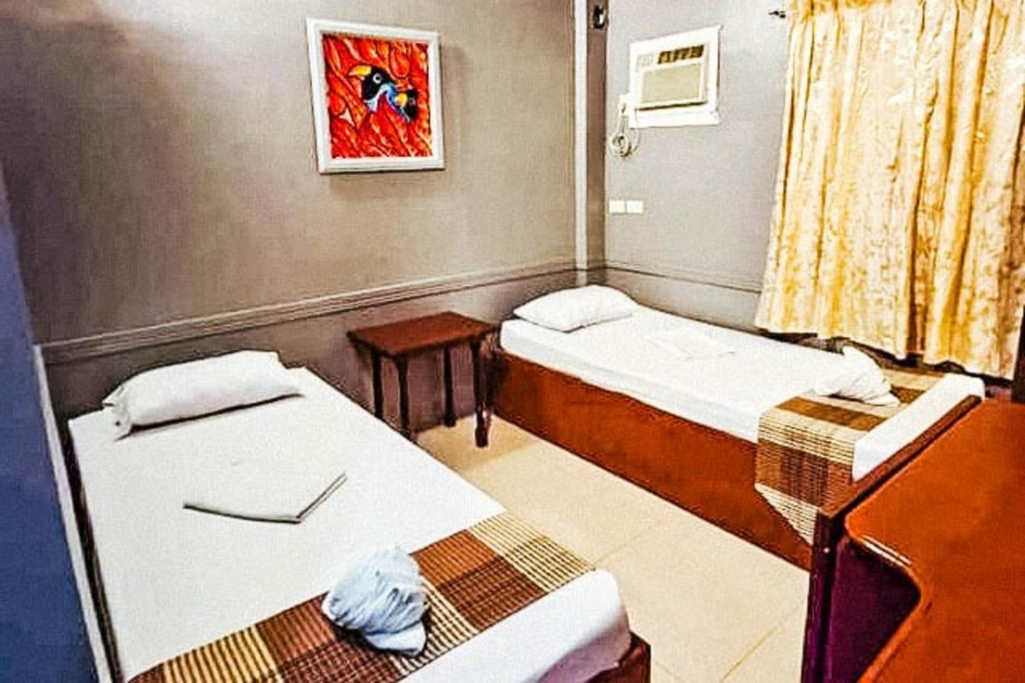 Mbg Travellers Inn Powered By Cocotel Пуэрто-Принцеса Номер фото