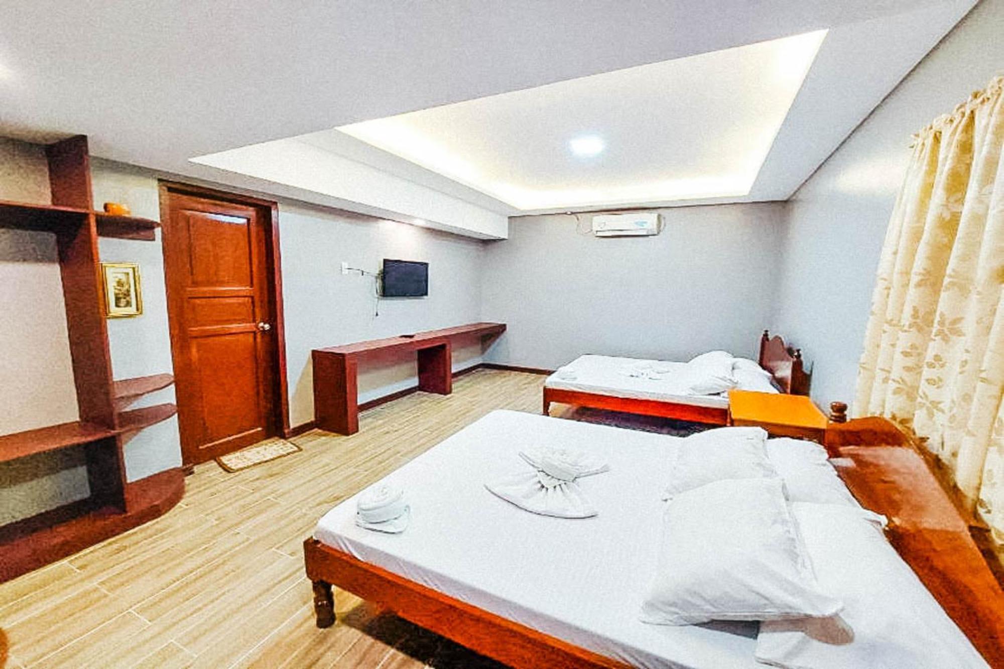 Mbg Travellers Inn Powered By Cocotel Пуэрто-Принцеса Номер фото