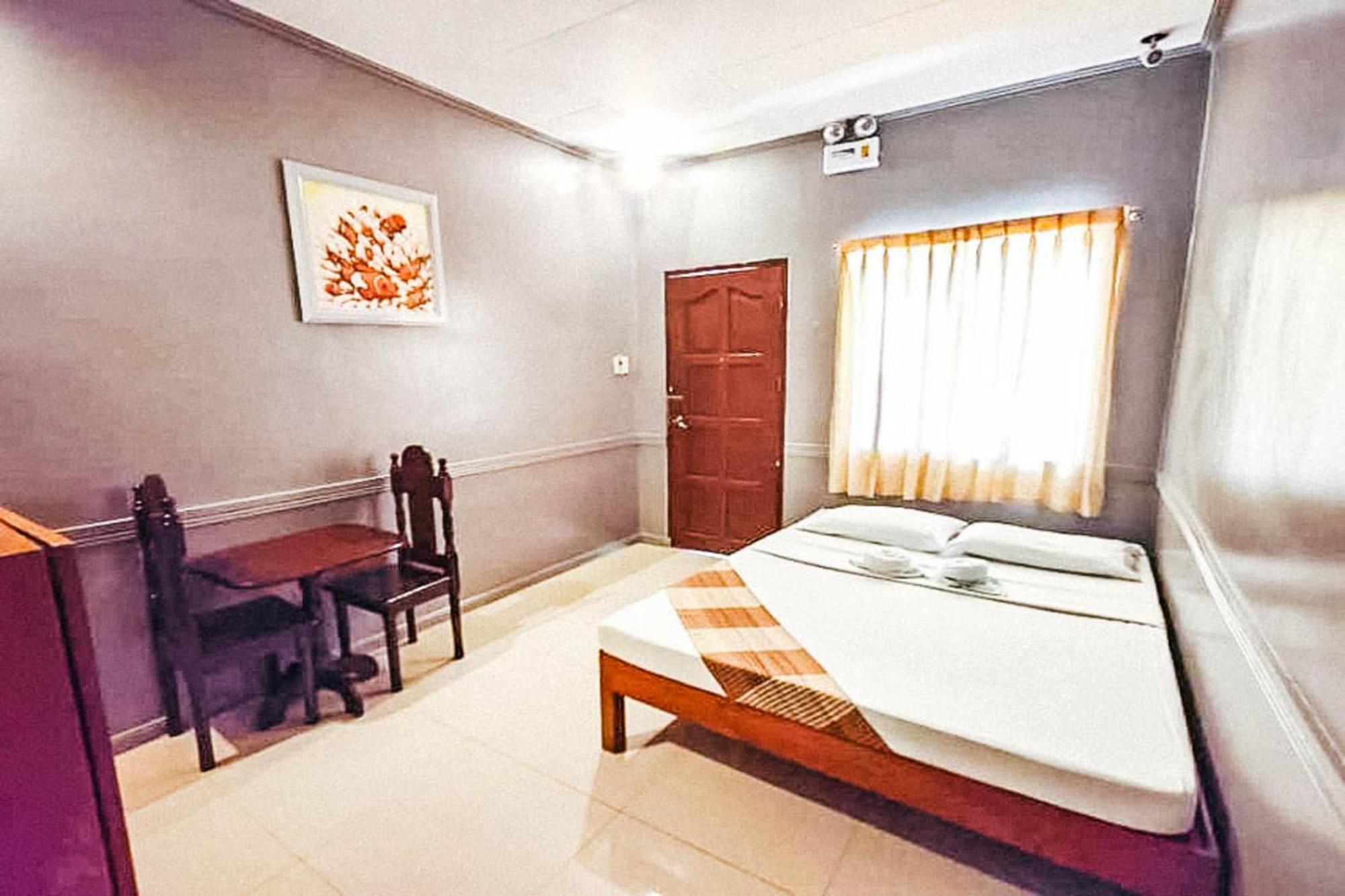 Mbg Travellers Inn Powered By Cocotel Пуэрто-Принцеса Номер фото