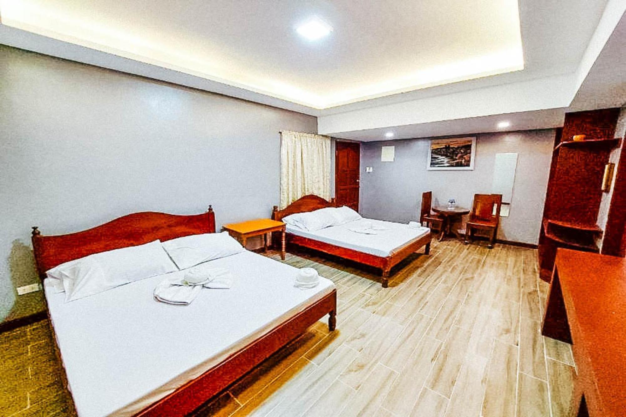 Mbg Travellers Inn Powered By Cocotel Пуэрто-Принцеса Номер фото